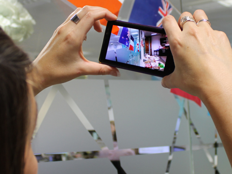 Someone taking a picture of various country flags