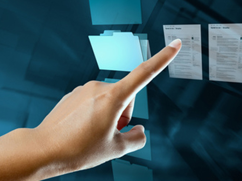 Hand pointing at documents
