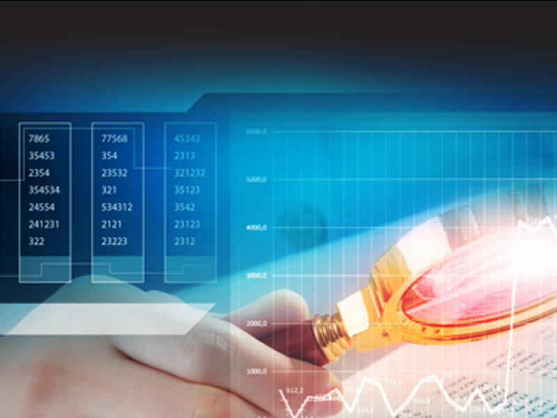 photo illustration of magnifying glass looking at data