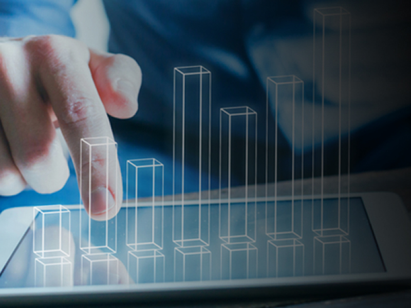 Hand pointing at 3-d graph over tablet computer
